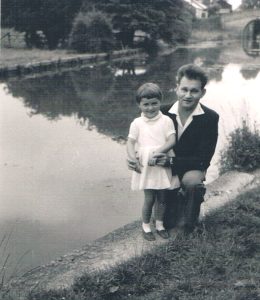 A photograph of Edward crouching with his young niece Alina Gierszewska by canal