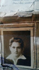 A photograph of the travel document of Edward Buczak at 16 on his arrival in England