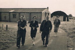 Jozef Latyszonek,unknown, Bojarski, unknown, with two huts behind, probably on Site 8