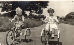 Krystyna Oleszkiewicz and Irena Wesolowska riding tricycles at Site 3