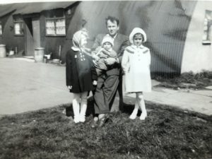 Outside the Wesolowski hut, site 3 - Waldemar Wesolowski with Irena and baby Mieczyslaw, and Krystyna Oleszkiewicz (R)