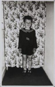 Stan with curtain partitioning behind