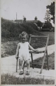 Stanislaw at Site 12 with air raid shelter and Church Farm behind